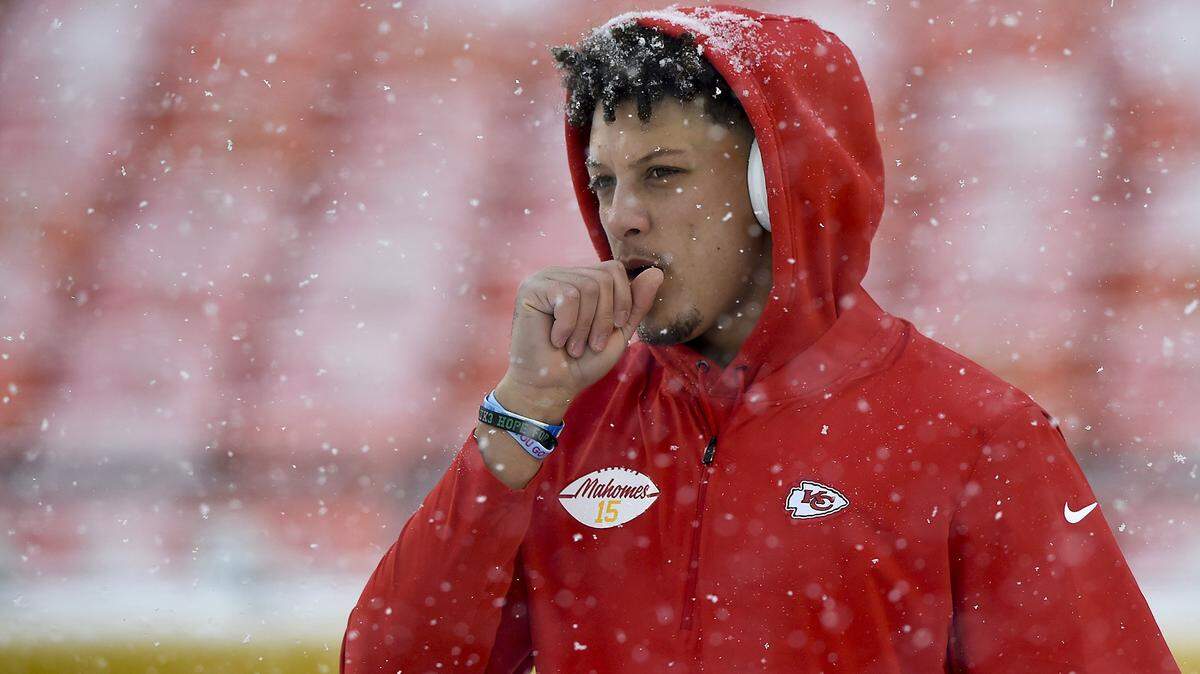 In a Sunday snow special, Chiefs quarterback Patrick Mahomes warms up before the Kansas City-Denver game at Arrowhead Stadium in Kansas City.