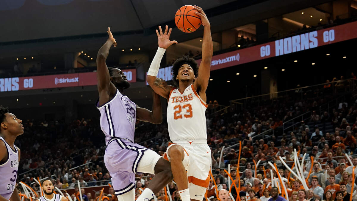 Texas Longhorns forward Dillon Mitchell (23) drives to the basket against Kansas State Wildcats center Abayomi Iyiola (23) during the first half at Moody Center on Jan. 3, 2023.
