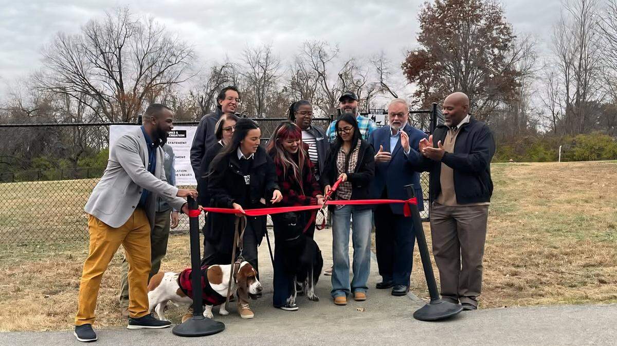Samantha Osorio and Martiza Hernandez, two former Washington High School students, participate in a ribbon cutting for Welborn Dog Park on Nov. 17, 2025. They were joined by supporters and government staff and officials that helped them along the way.
