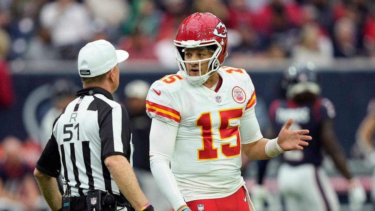 Chiefs quarterback Patrick Mahomes talks to referee Carl Cheffers after a call during Sunday’s game at NRG Stadium.