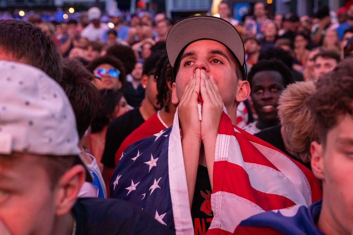 Fans look dejected after the US gives up a third goal during the USA Round of 16 match vs. Belgium at the Power & Light District on Monday, July 6, 2026.