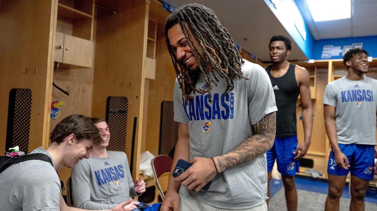 Kansas guard Bobby Pettiford Jr. laughs with teammates after the team’s practice at Wells Fargo Arena on Friday, March 17, 2023, in Des Moines, Iowa. Kansas plays No. 8 seed Arkansas Saturday in a second-round game of the NCAA Tournament.