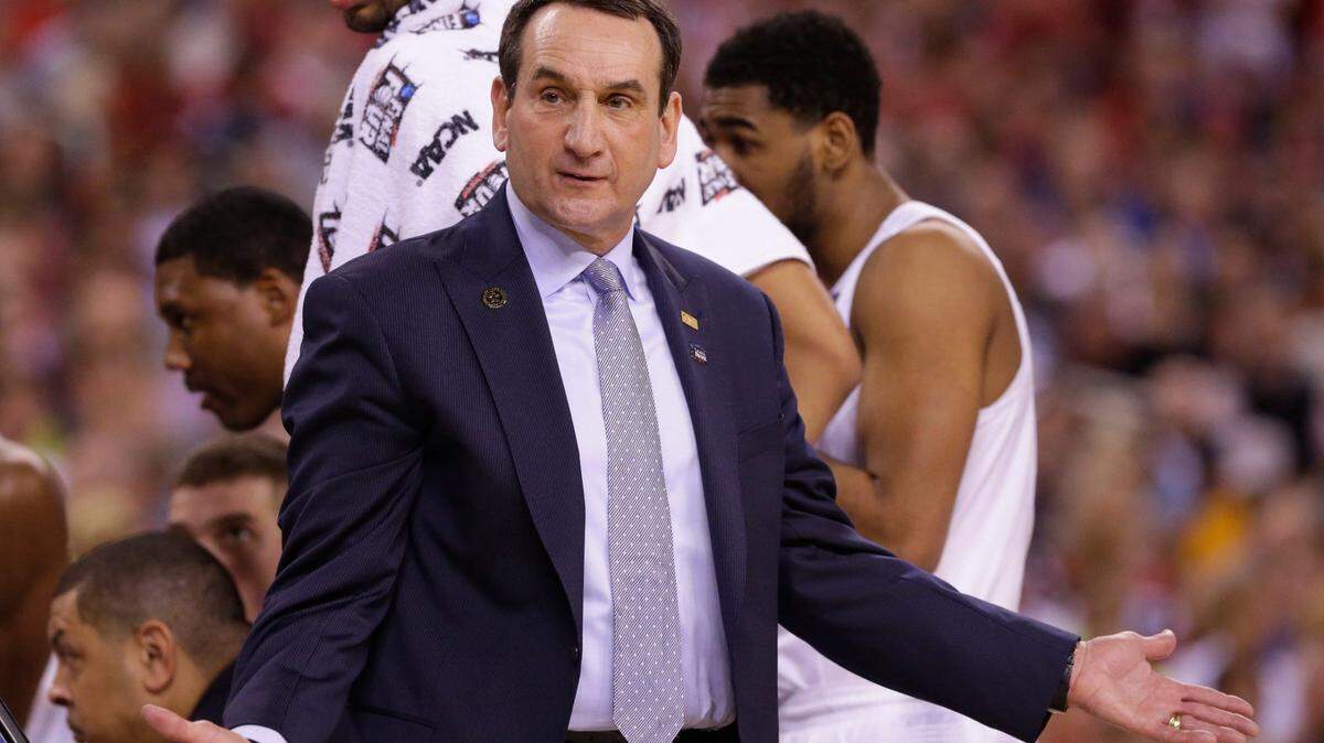 Former Duke head coach Mike Krzyzewski argues a call during first half of their NCAA Final Four college basketball tournament championship against Wisconsin Monday, April 6 2015 at Lucas Oil Stadium in Indianapolis.