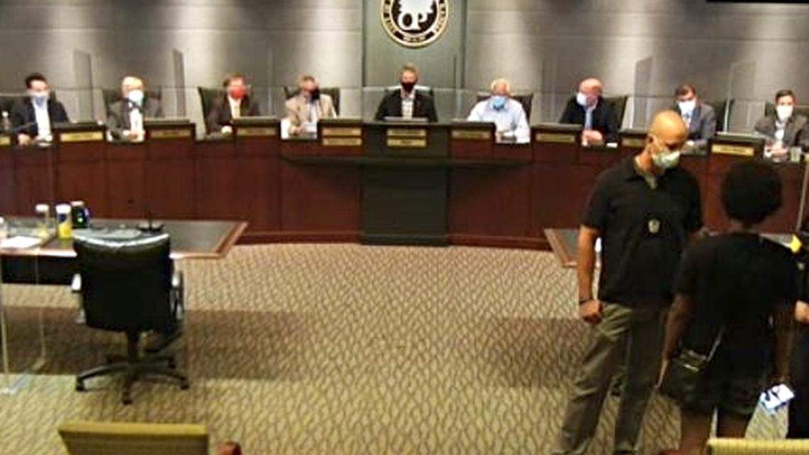 After $70,000 police payout, protesters take over Overland Park council meeting
