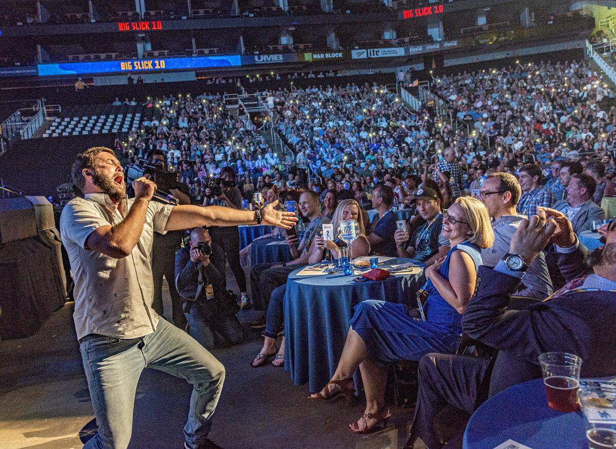 “Saturday Night Live” alum Taran Killam took to the audience to serenade a flattered Karli Daigle with “All My Life” during the Big Slick auction at the Sprint Center.