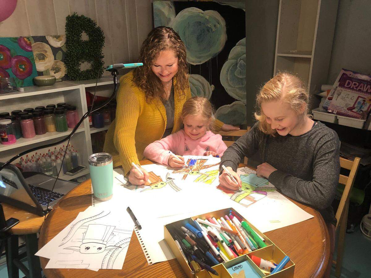 With school closed, Alexis Burdick, a visual art teacher at Shawnee Mission North High School, has been holding drawing lessons with her daughters, Clara Burdick, 12, and Bria Burdick, 7.