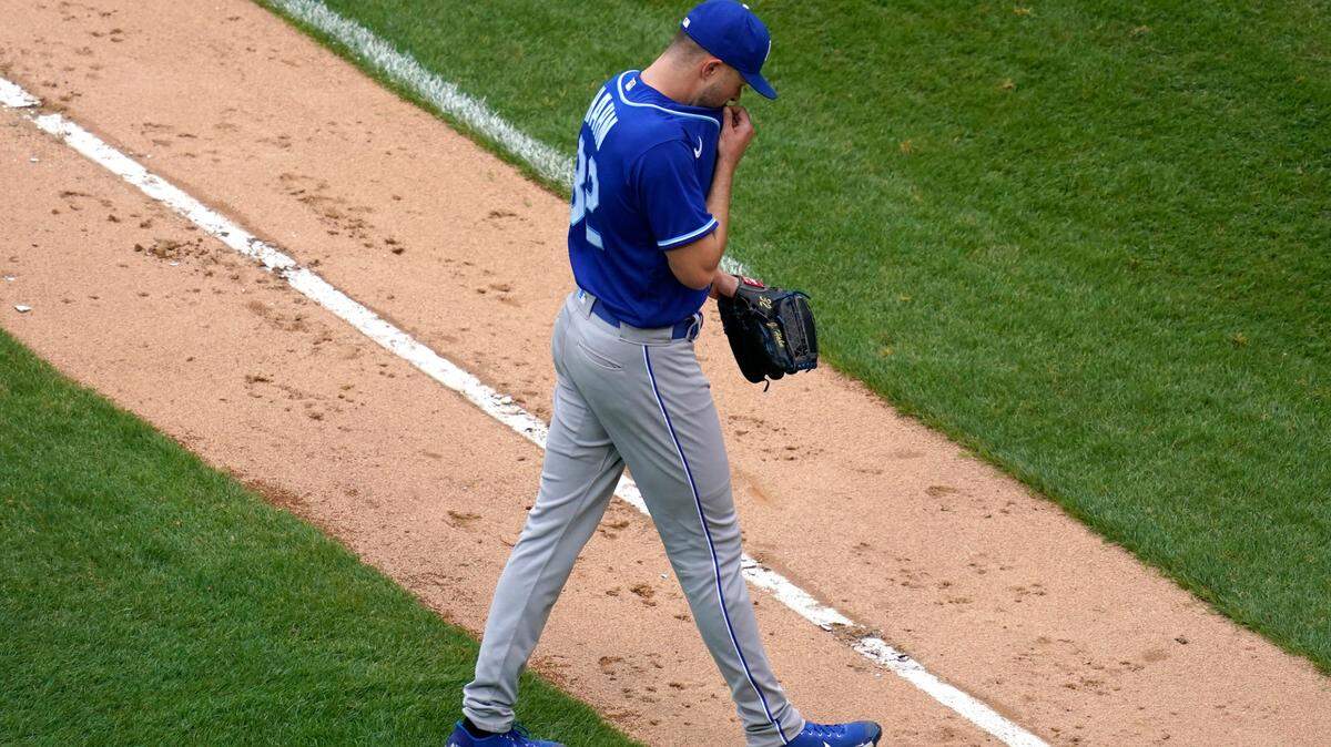 Kansas City Royals relief pitcher Jesse Hahn wipes his face as he leaves the field during the eighth inning of a baseball game against the Chicago White Sox in Chicago, Sunday, April 11, 2021. (AP Photo/Nam Y. Huh)
