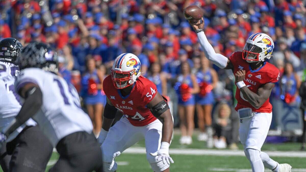 Kansas quarterback Jalon Daniels (6) throws a pass in the first half against the TCU Horned Frogs at David Booth Kansas Memorial Stadium on Saturday, Oct. 8, 2022.
