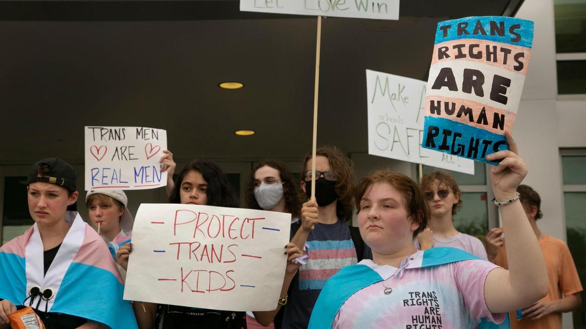 Rylan Mance, right, and fellow Gardner Edgerton High School students protested outside Gardner City Hall after marching there from the school in September. They were calling attention to a proposed plan on transgender students’ use of school bathrooms and locker rooms.