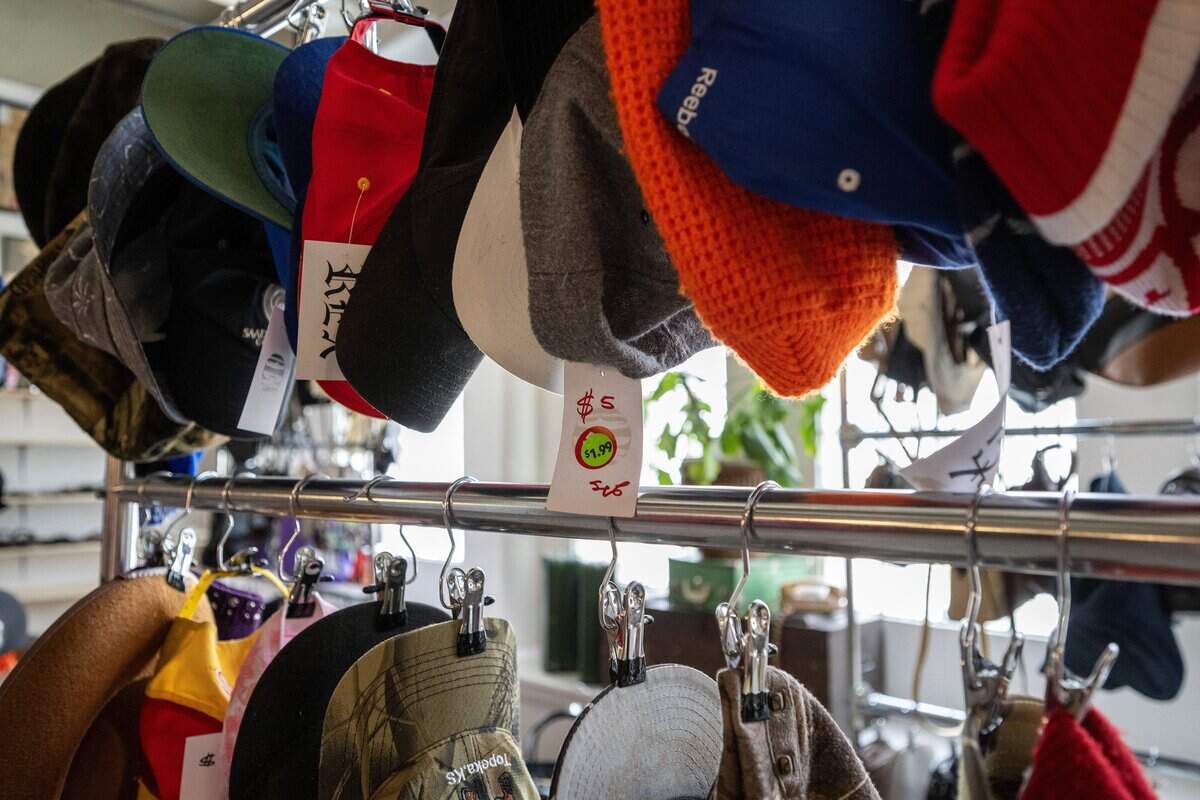 Various styles of hats, including one priced at $5, are displayed on racks on the first floor of Rex on Wednesday, July 15, 2026, in Kansas City.