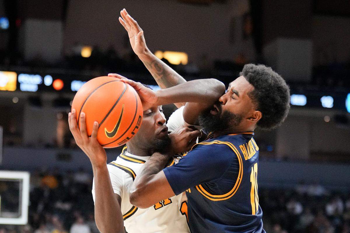 Missouri Tigers guard Marques Warrick, left, fights off California Golden Bears guard Jovan Blacksher Jr. during a Tuesday, Dec 3, 2024 men’s college basketball game at Mizzou Arena in Columbia.