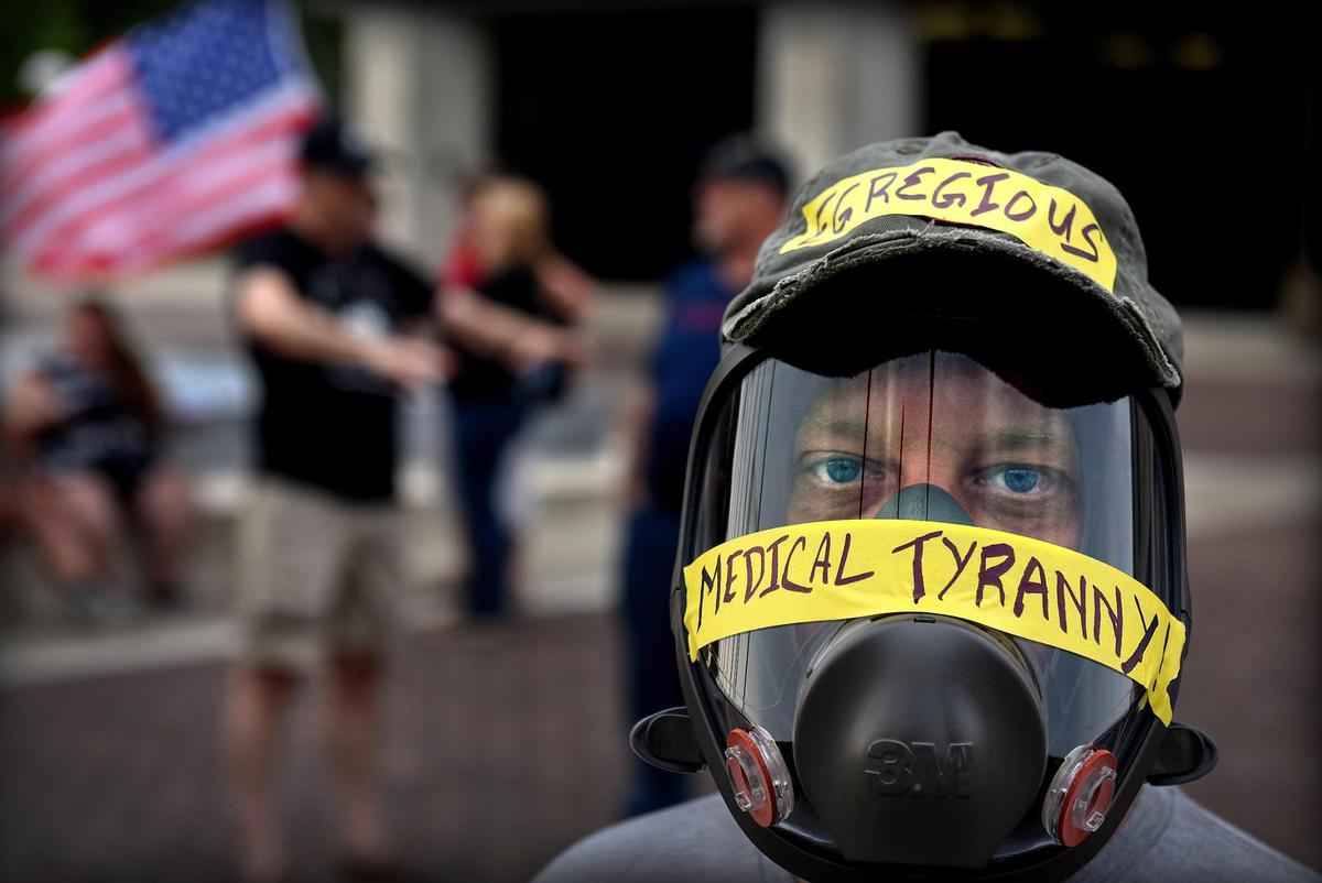 With the Unified Government of Wyandotte County and Kansas City, Kansas meeting virtually Thursday evening on whether to impose a mask mandate, anti-mask protesters gathered outside county offices in downtown KCK. About 60 people gathered to voice their opposition to any mandate requiring residents to wear a mask in order to help slow the spread of the COVID-19 coronavirus and the delta variant in particular. One protester, who declined giving his name wore a gas mask to the gathering.