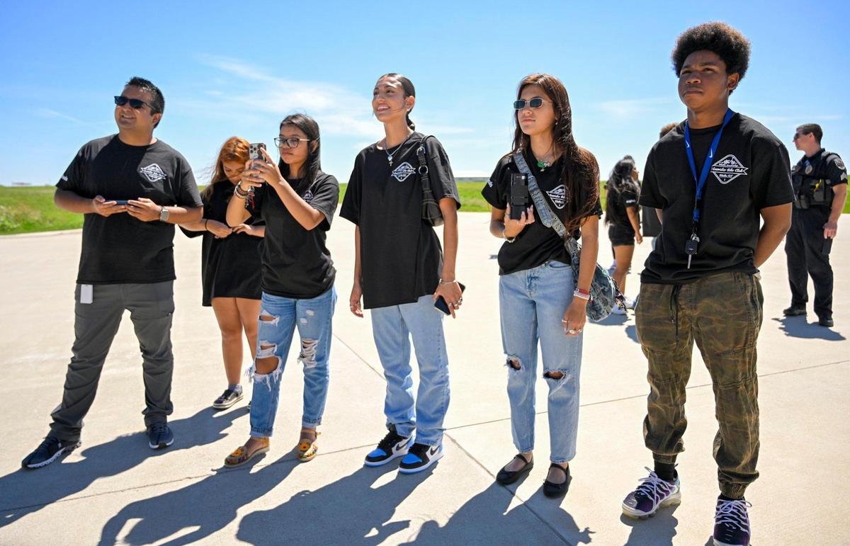Family, friends, and students from the lowrider bike club in the Olathe school district watched as Erik Erazo prepared for his ride with the U.S. Navy Blue Angels.