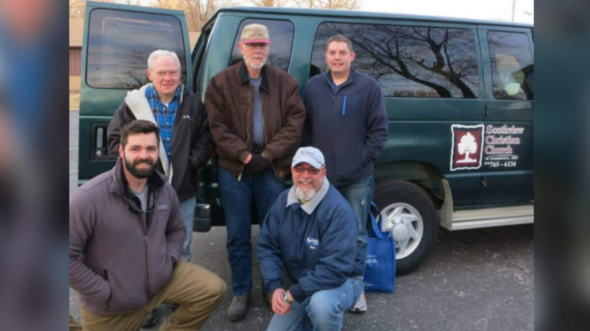 Members of Southview Christian Church in Grandview posed next to a church van that was stolen Friday night.