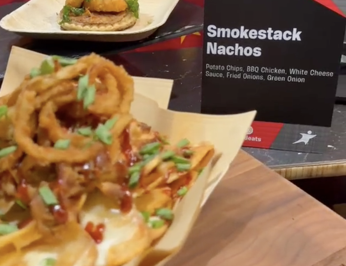 The Smokestack Nachos are potato chips topped with barbecue chicken, white cheese sauce, fried onions and green onion.
