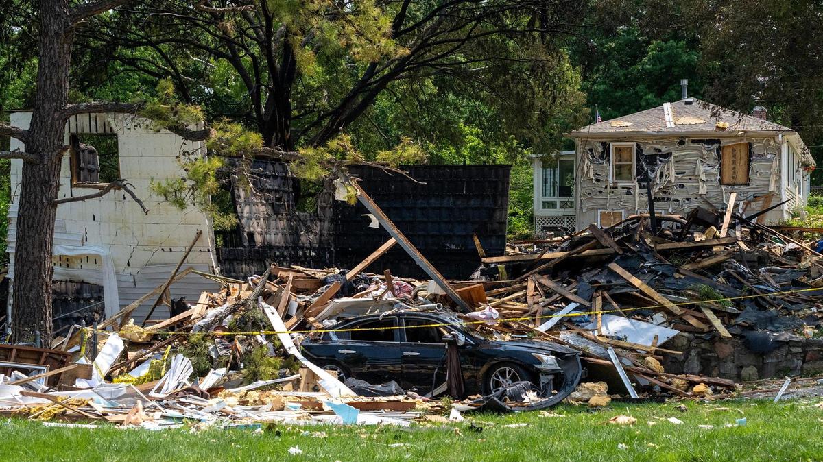 Debris is seen scattered across the site of a home explosion on Sunday, June 1, 2025, in Gladstone. The blast the day before killed one person and damaged nearby homes.