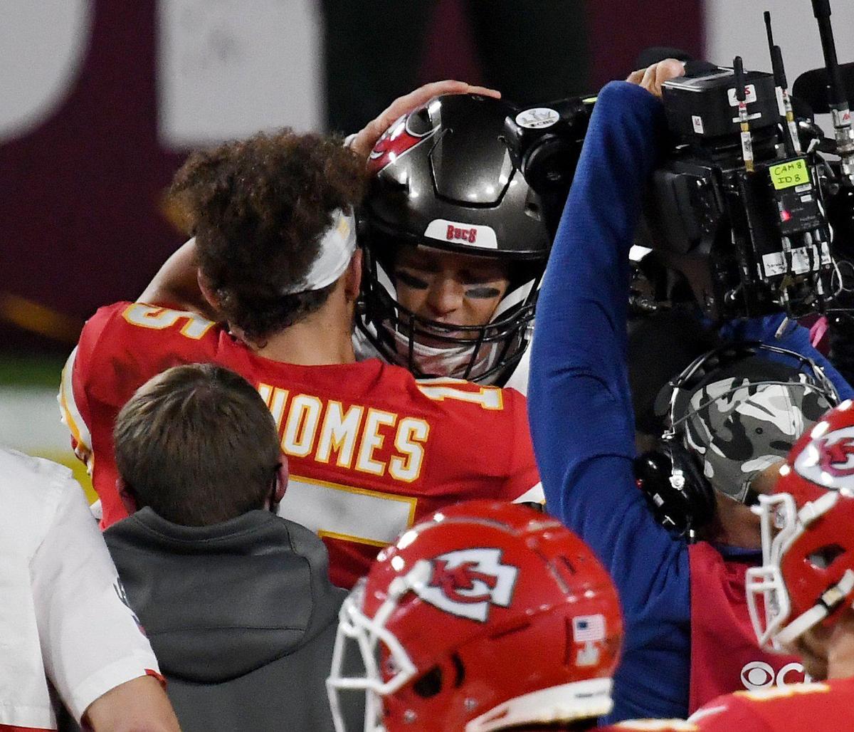 Kansas City Chiefs quarterback Patrick Mahomes and Tampa Bay Buccaneers quarterback Tom Brady hug at the end of the Kansas City Chiefs game against the Tampa Bay Buccaneers in Super Bowl LV at Raymond James Stadium in Tampa, Sunday, Feb. 7, 2021. The Buccaneers defeated the Chiefs 31-9.