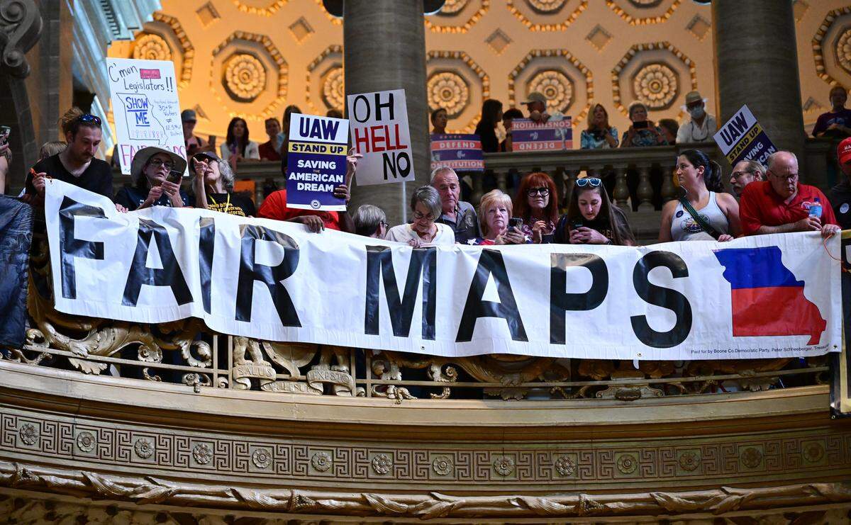 People gather at the Missouri statehouse in Jefferson City on Wednesday, Sept. 10, 2025, to protest the legislature's efforts to change the state's congressional district maps. The proposed change would divide Kansas City into districts that would include vast rural areas of the state.
