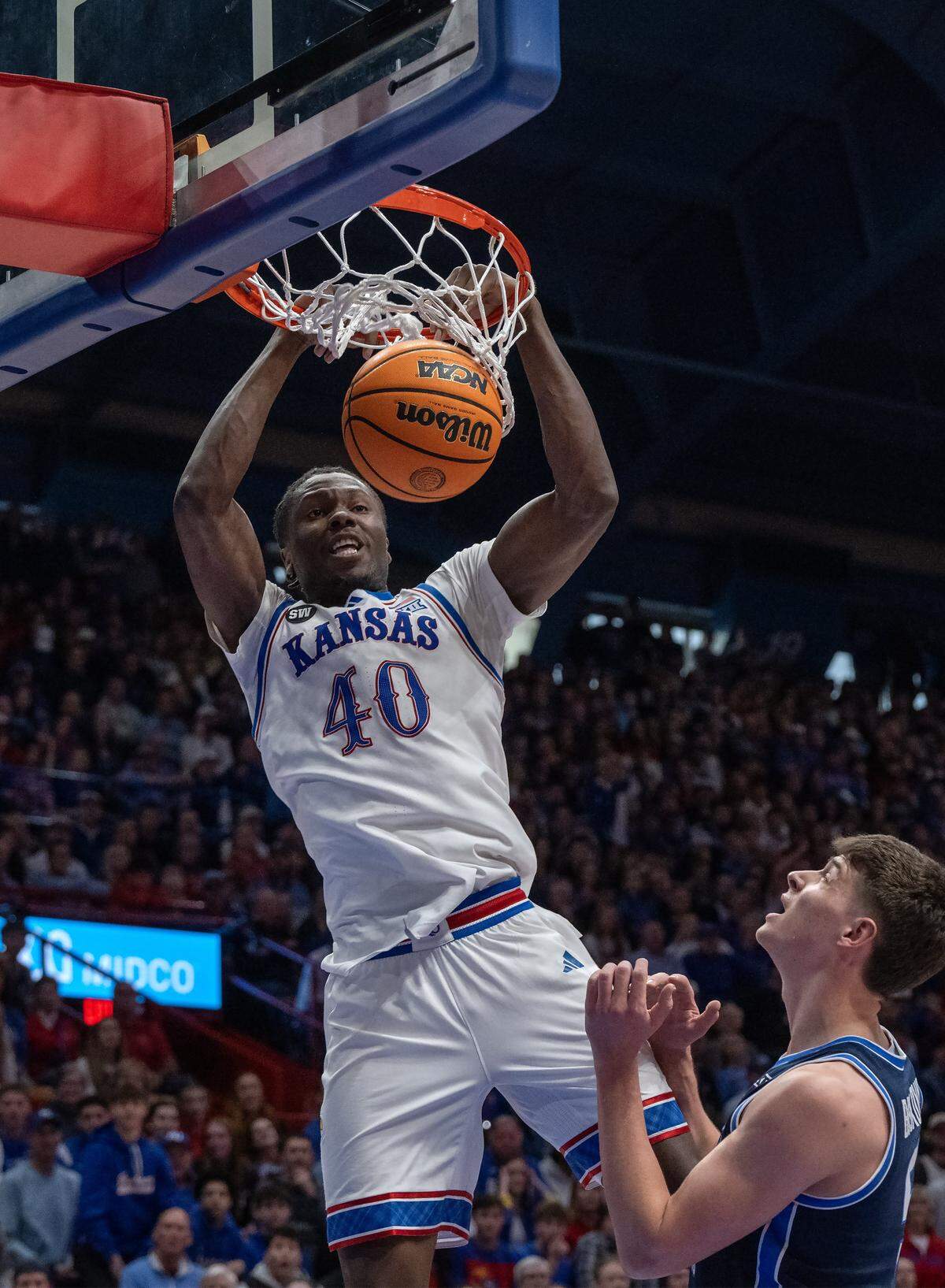 Kansas Jayhawks forward Flory Bidunga (40) slams a dunk against BYU Cougars in the first half at Allen Fieldhouse on Saturday, Jan. 31, 2026, in Lawrence.