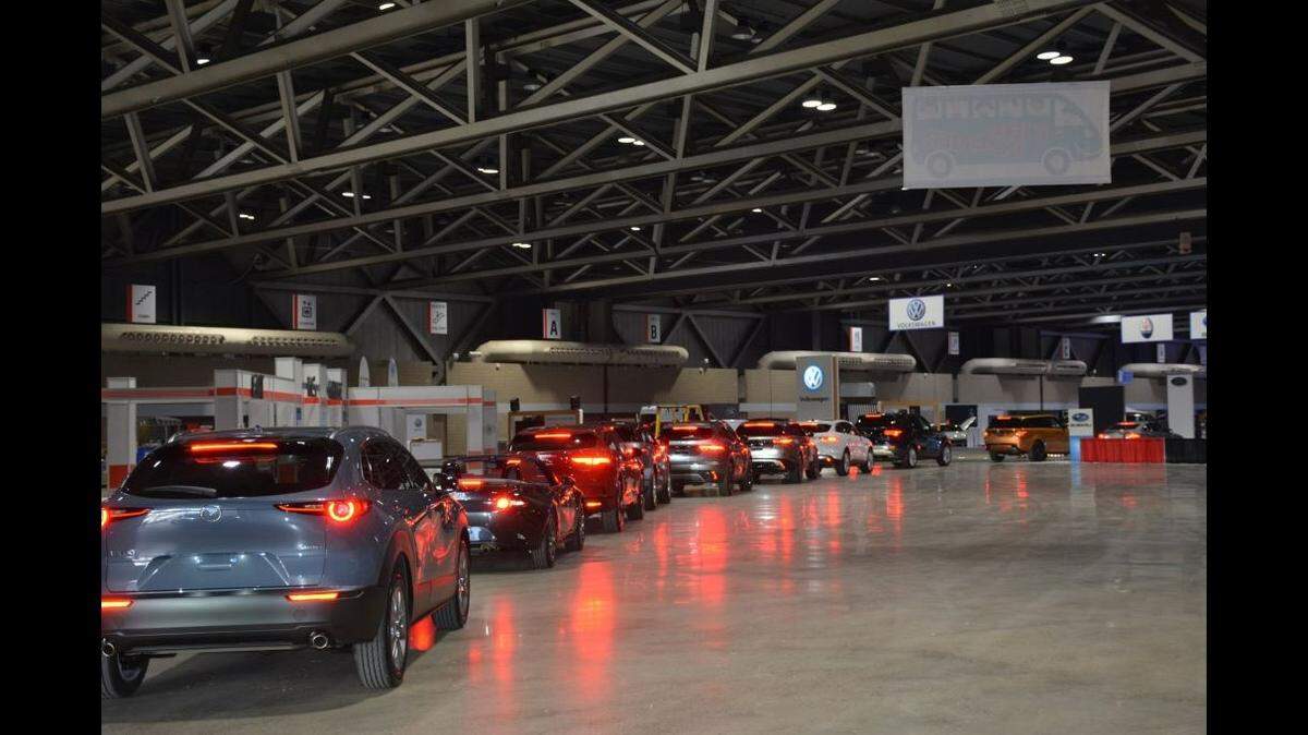 Cars line up to enter the floor at Bartle Hall, the site of 2024’s Kansas City Auto Show.