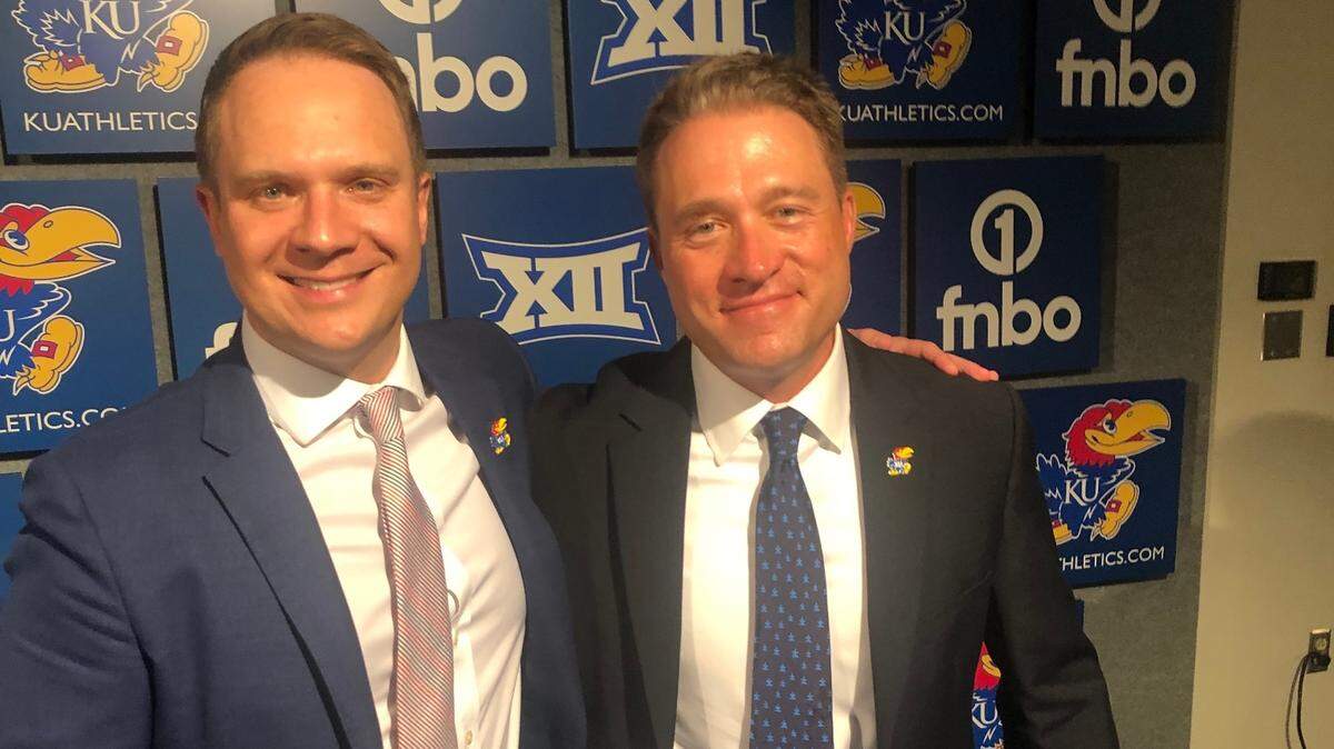 New Kansas baseball coach Dan Fitzgerald, right, visited with KU athletic director Travis Goff after Thursday’s introductory news conference in Lawrence.