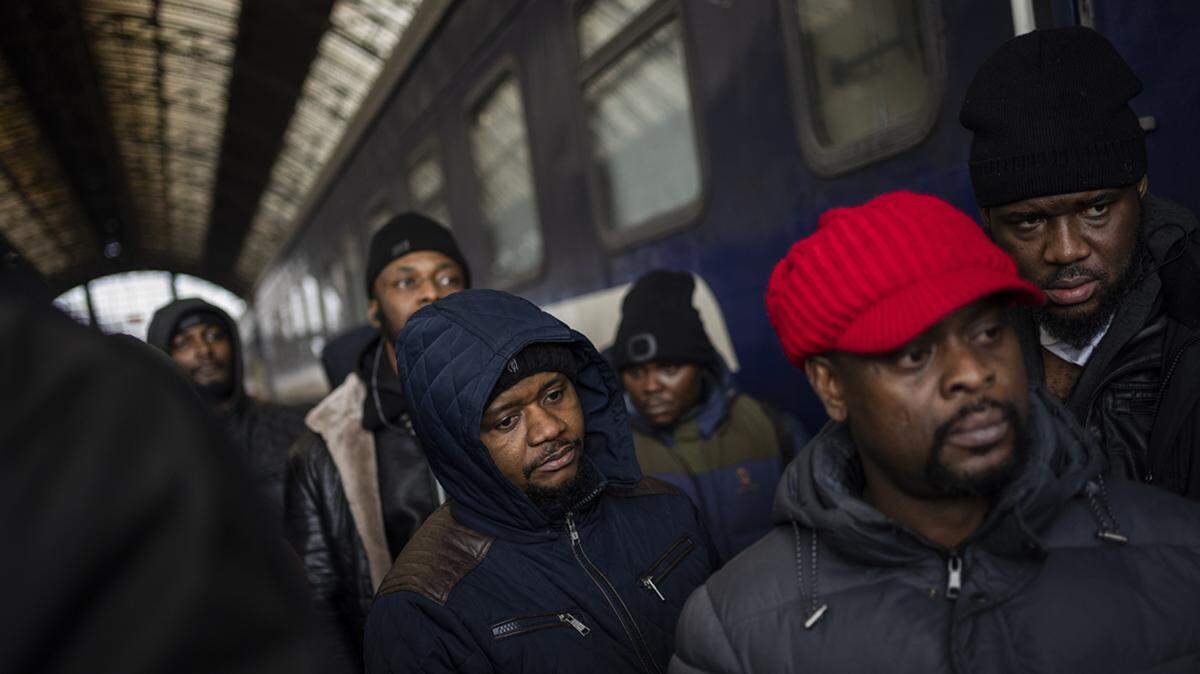 African residents in Ukraine wait at the platform inside Lviv railway station, Sunday, Feb. 27, 2022, in Lviv, west Ukraine.