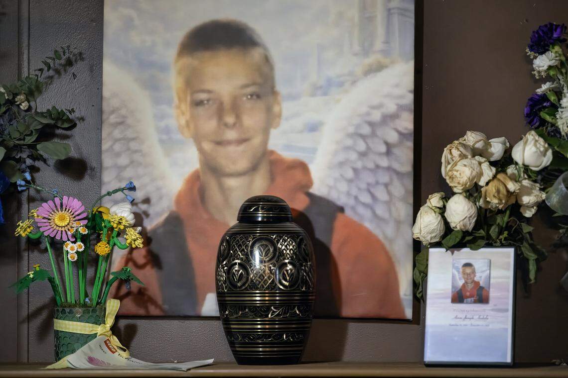 Charles “Jody” Andula created a memorial for his 13-year-old son, Airen, inside their home in the Holiday Lakes community near Pleasanton, Kansas. Airen died on December 22, 2025, from multiple dog bite injuries. Andula said someone painted angel wings on a portrait of Airen. The memorial was photographed on Monday, Jan. 12, 2026. 