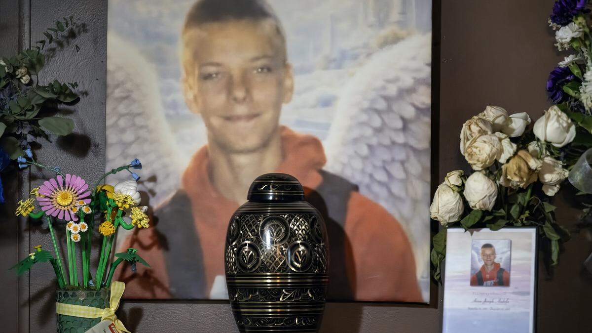 Charles “Jody” Andula created a memorial for his 13-year-old son, Airen, inside their home in the Holiday Lakes community near Pleasanton, Kansas. Airen died on December 22, 2025, from multiple dog bite injuries. Andula said someone painted angel wings on a portrait of Airen. The memorial was photographed on Monday, Jan. 12, 2026.