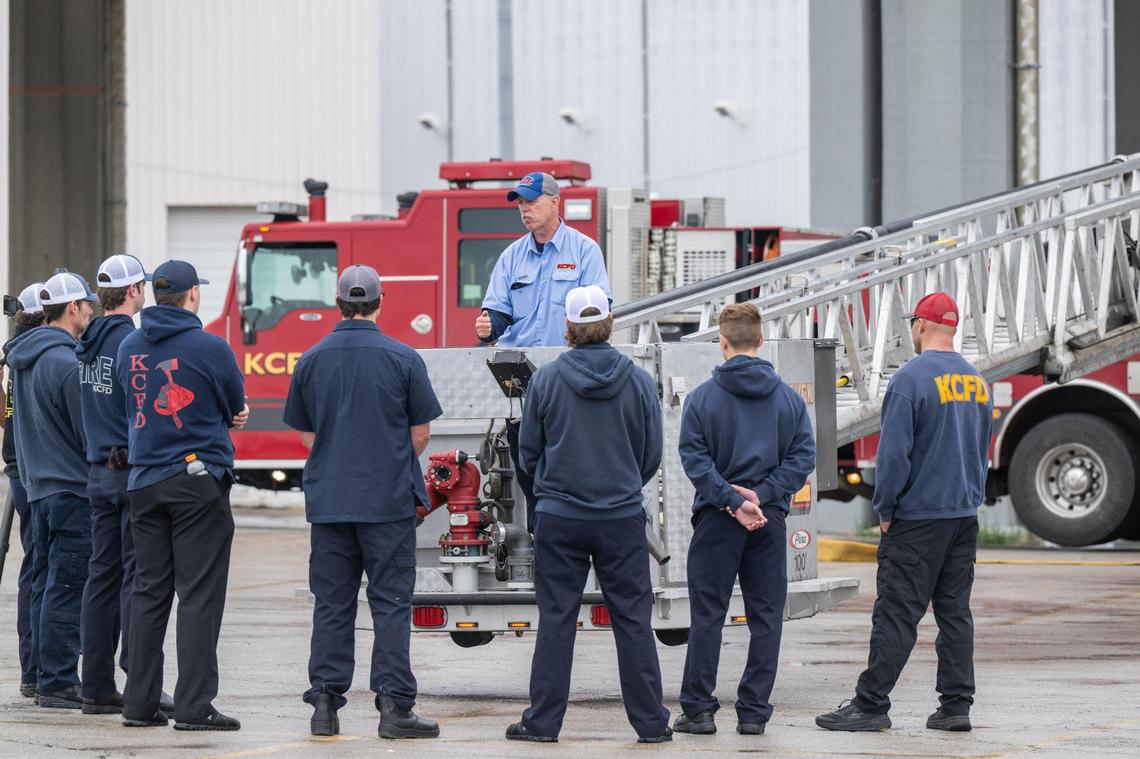 KCFD Cpt. John Young trains a group of firefighters on the proper use of the aerial work platform of a fire engine in Kansas City on Thursday, May 29, 2025. The Kansas City Fire Department held a public training event to showcase their new driver training program.