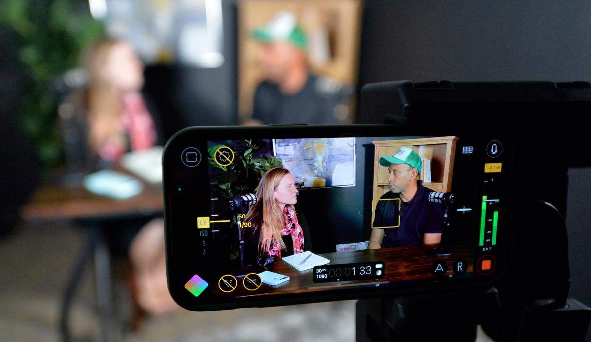 Mike Rollen, owner of Ophelia’s Blue Vine Farm, is interviewed by Kansas City Star reporter Anna Spoerre, about this business at KC Gift’s studio.