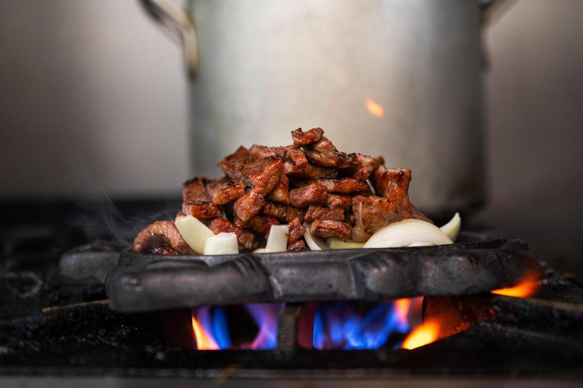 Choga serves its marinated short ribs, or galbi, on a bed of caramelized yellow onions. The ribs can be cooked to order, or customers can cook them themselves at the table.
