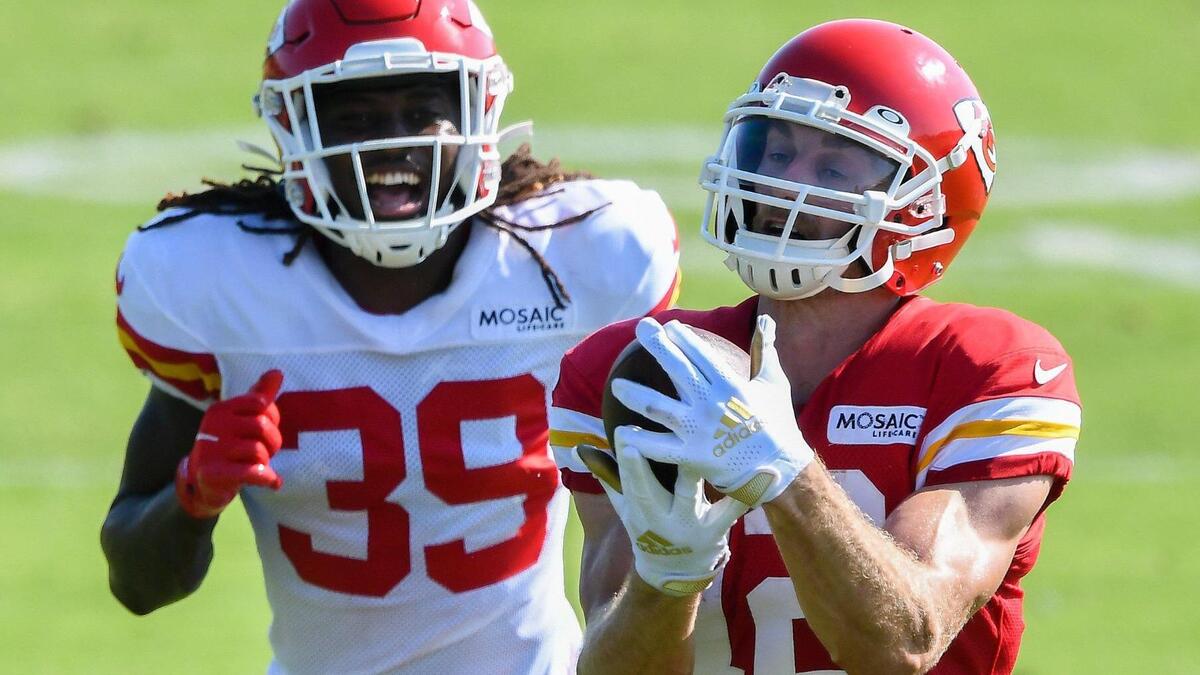 Wide receiver Gehrig Dieter makes a catch as rookie defensive back Marlon Character appears to celebrate it during Kansas City Chiefs training camp at Missouri Western State University in St. Joseph Tuesday, Aug. 17, 2021.