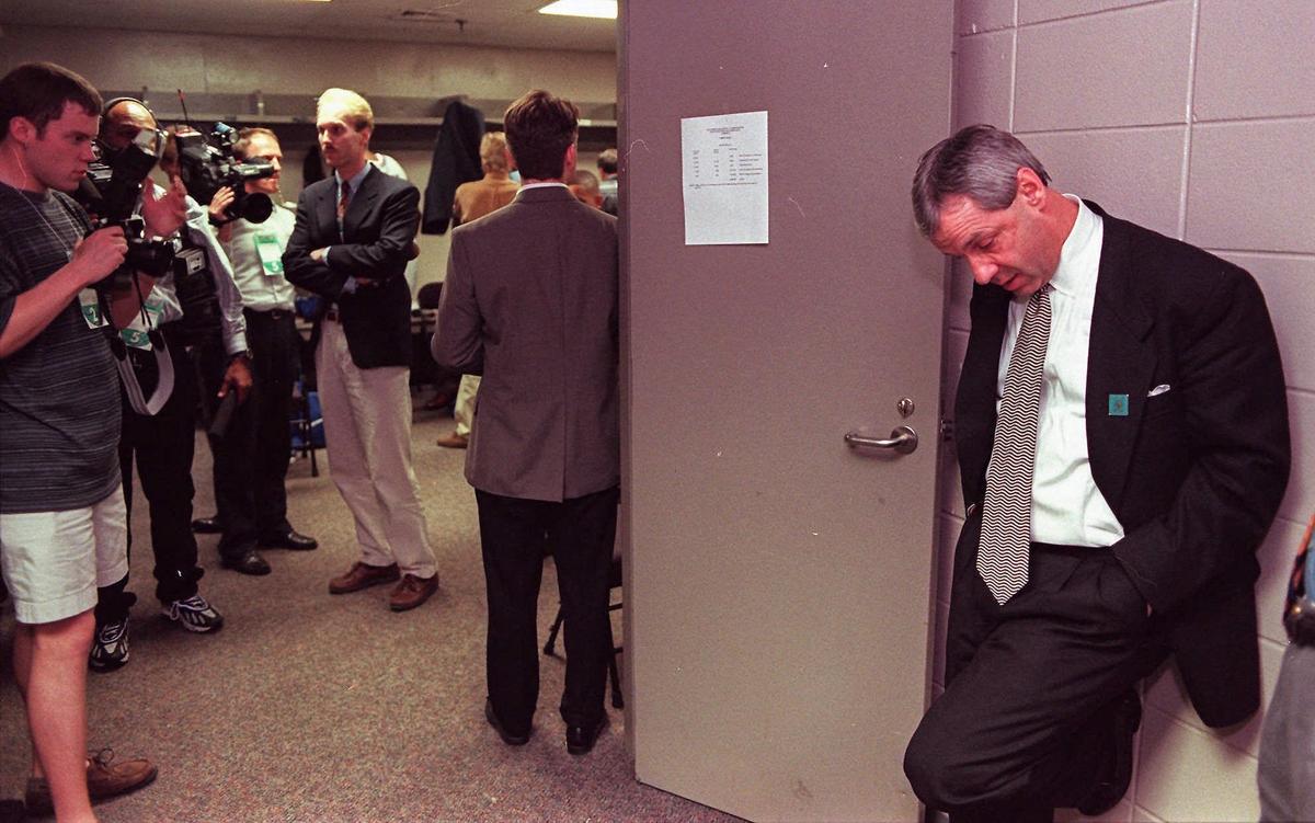 Kansas coach Roy Williams takes a moment before meeting with the media after his Jayhawks lost to Arizona 85-82 in their NCAA Southeast regional semifinal game March 21, 1997, in Birmingham, Ala. The loss was devastating, ruining what was supposed to be their magical season. When the top-ranked Kansas Jayhawks were knocked out of the NCAA tournament by eventual champ Arizona last season, coach Roy Williams looked inward and to others for strength.