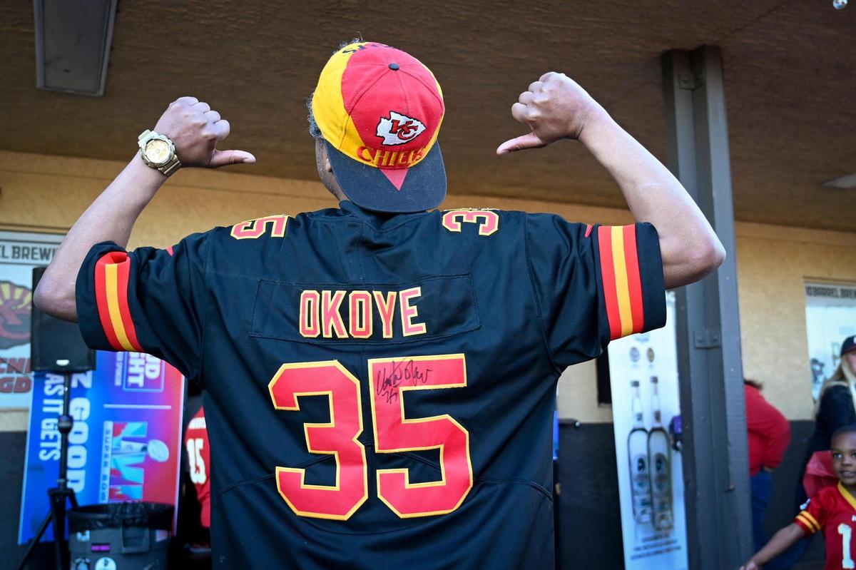 Kansas City Chiefs fan Paul Nyakatura of Kansas City, showed off his Christian Okoye jersey as Chiefs fans gathered Wednesday, Feb. 8, 2023 at Pub Rock Live, a Chiefs bar in Scottsdale, Arizona.