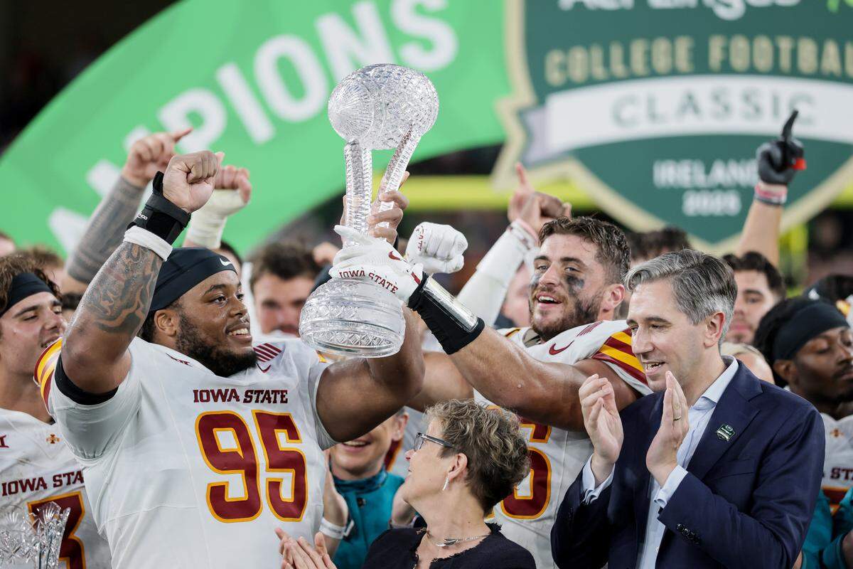 Iowa State is presented with the Waterford trophy after defeating Kansas State during the Aer Lingus Classic at Aviva Stadium in Dublin on Aug. 23, 2025.