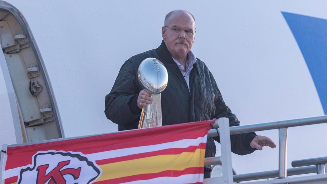 Kansas City Chiefs’ head coach Andy Reid holds the Lombardi Trophy as he steps off the team’s charter plane at Kansas City International Airport on Tuesday.
