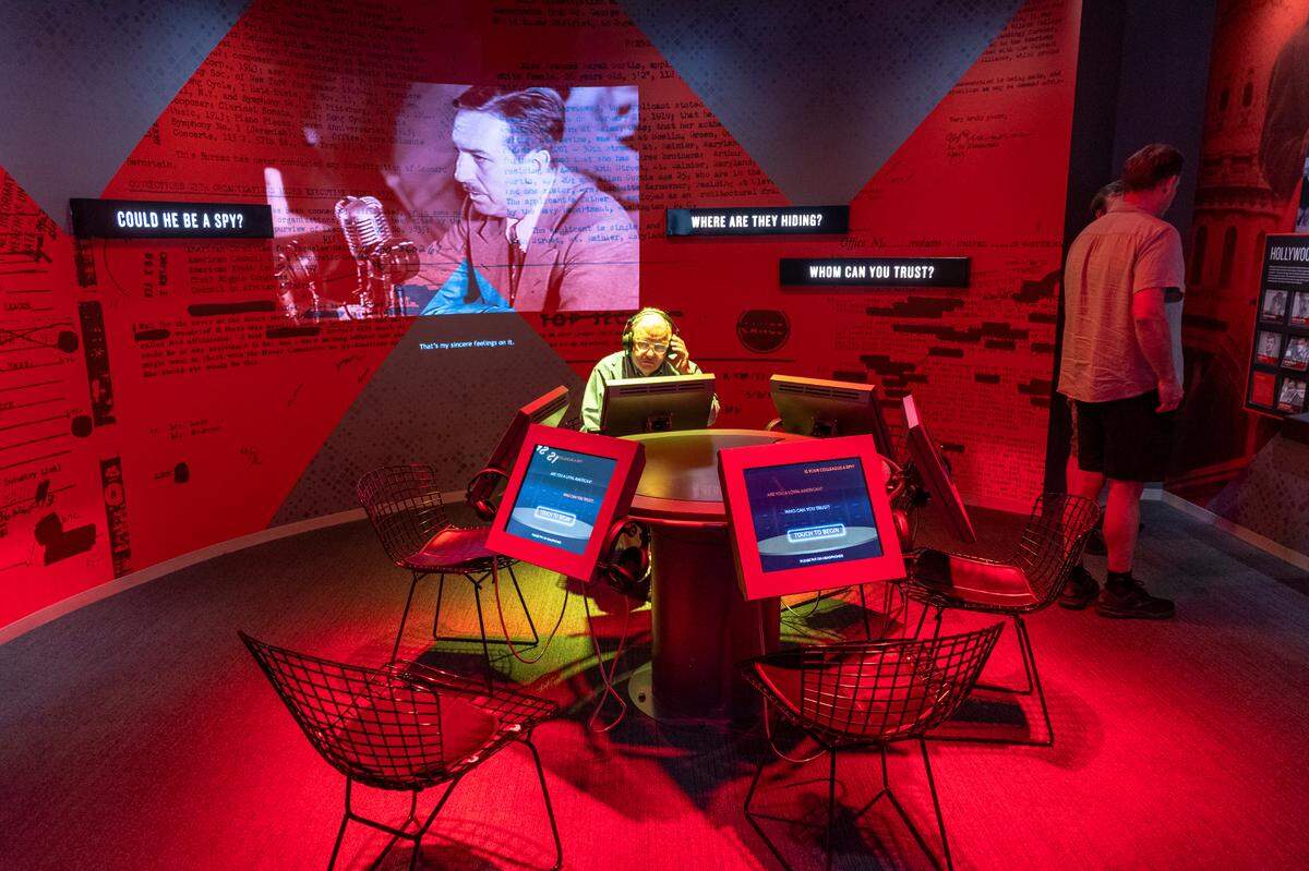 Tweed Roosevelt, great-grandson of Teddy Roosevelt, explores an interactive exhibit about the Red Scare.