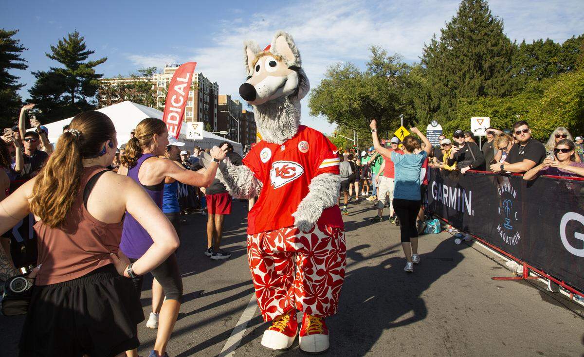 KC Wolf, the Kansas City Chiefs’ NFL mascot, greeted runners as they crossed the finish line at the Garmin Kansas City Marathon on Saturday, Oct. 18, 2025, in Kansas City.