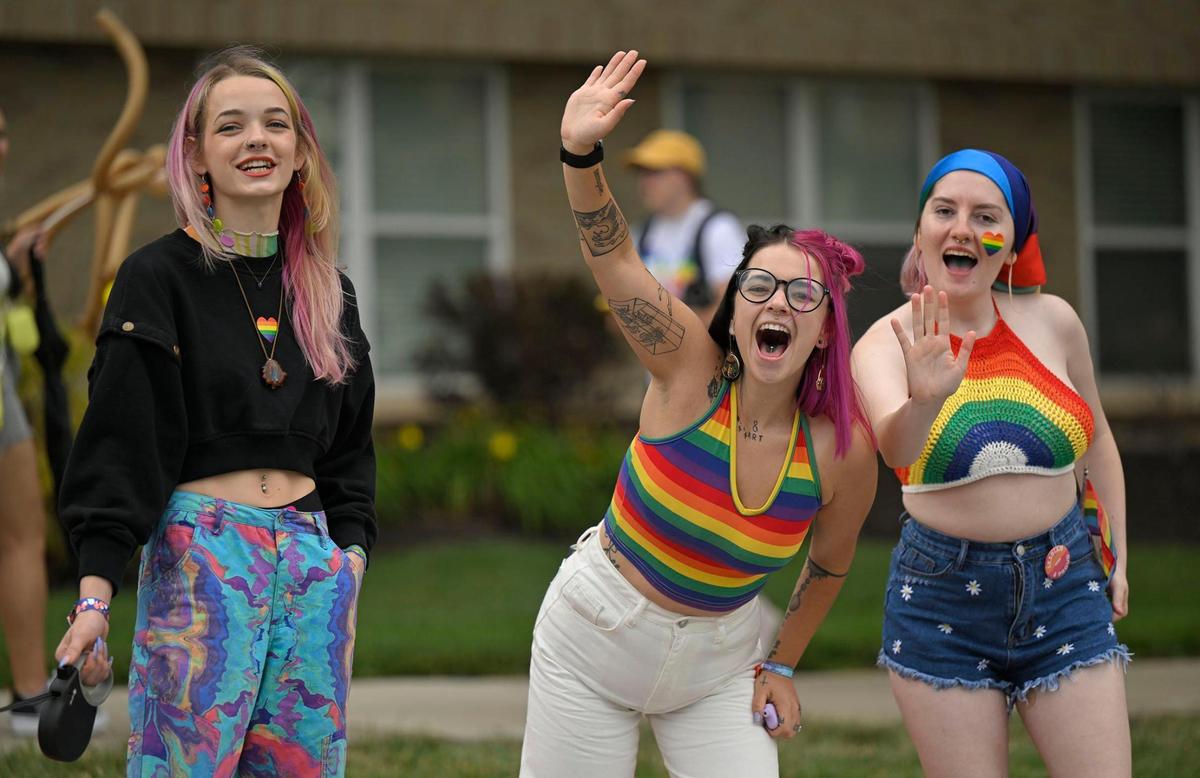 Lea Helm, Alivia Kober and Kristina Wilson, all of Kansas City, cheered on the participants during the KC Pride parade on Saturday.