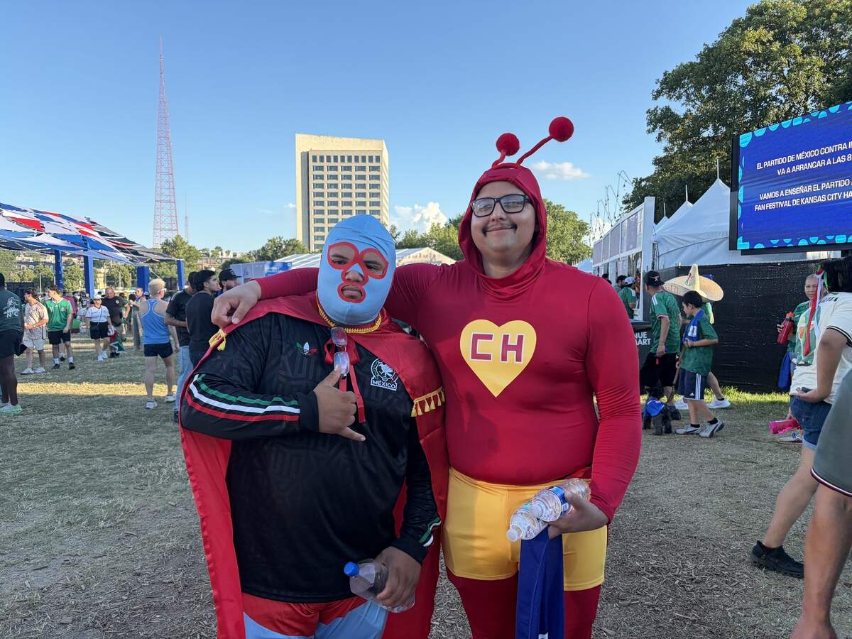 Ernan Silva and Richard Villalobos were dressed as Nacho Libre and El Chapulín Colorado, respectively, at FIFA Fan Fest Sunday, July 5. They were at the festival to watch Mexico take on England in the round of 16.