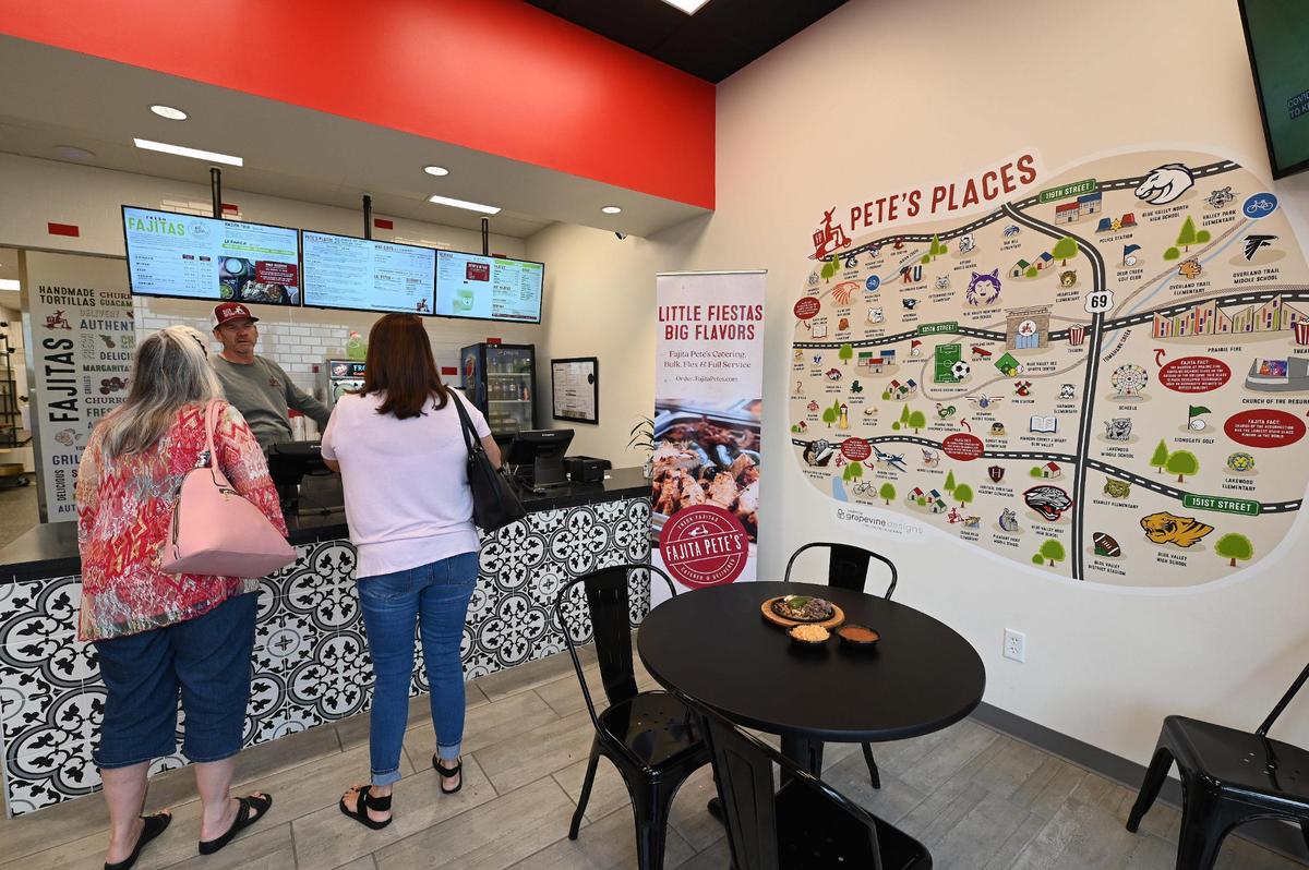 Owner Scott Keen talks with customers as they place their lunch orders at Fajita Pete’s, 8909 W. 135th St., in Overland Park.