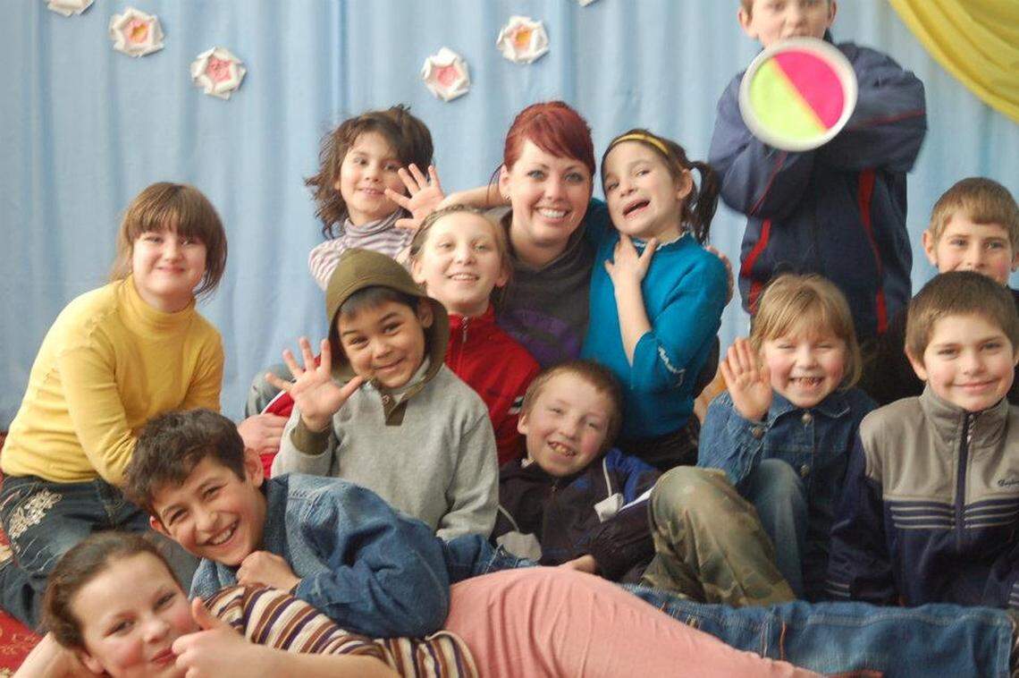 Paige Barrows (center) taught English in Ukraine as a Peace Corps volunteer from 2010 to 2012. She has raised thousands of dollars this year to help people who area still in the country.