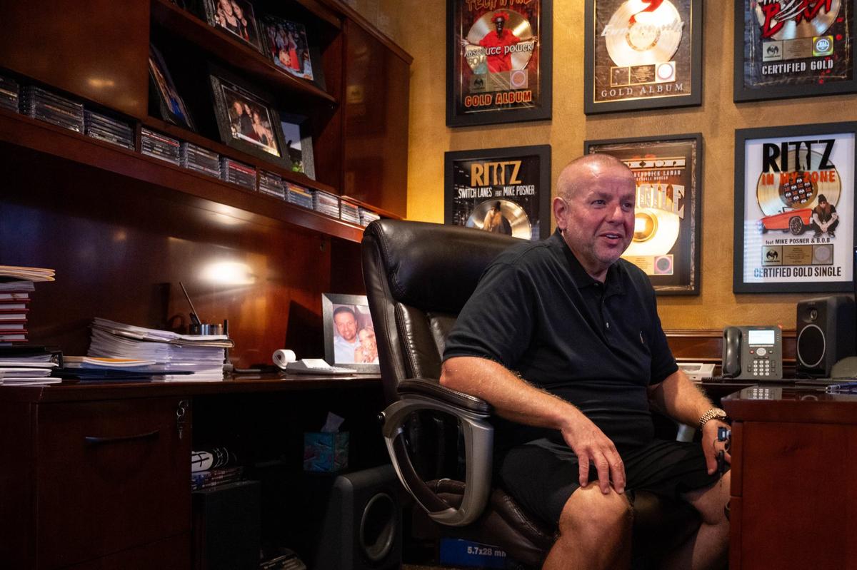 Travis O’Guin, President and Founder of Strange Music, in his office at Strange Land Recording Studios. O’Guin and recording artist Tech N9ne founded Strange Music in 2000. O’Guin’s office is adorned with RIAA Gold album plaques and personal keepsakes.