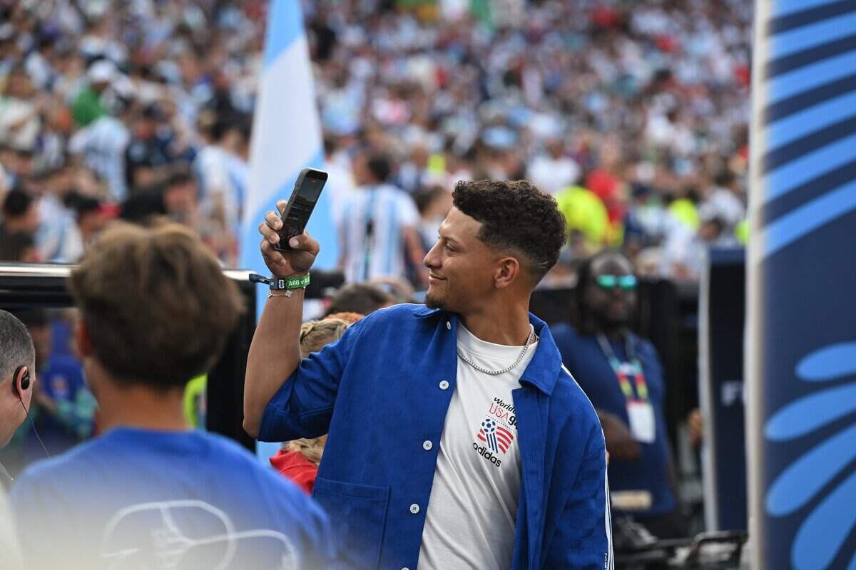 Kansas City Chiefs quarterback Patrick Mahomes takes a photo of the electric atmosphere ahead of the Argentina vs. Algeria FIFA World Cup group-stage soccer match at Kansas City (Arrowhead) Stadium in Kansas City on Tuesday, June 16, 2026.