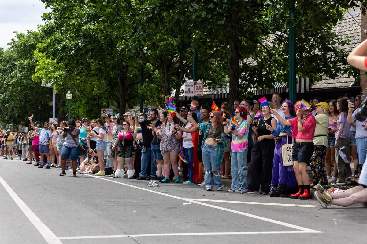 Parade goers watch the annual Kansas City Pride Parade from the side of the street at Westport Rd on Saturday, June 6, 2026.
