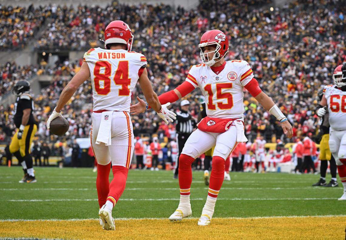 Chiefs wide receiver Justin Watson (No. 84) and Kansas City quarterback Patrick Mahomes (No. 15) celebrate their 11-yard touchdown connection during an NFL Week 17 game against the Steelers at Acrisure Stadium in Pittsburgh, Pennsylvania on Wednesday, Dec 25, 2024.