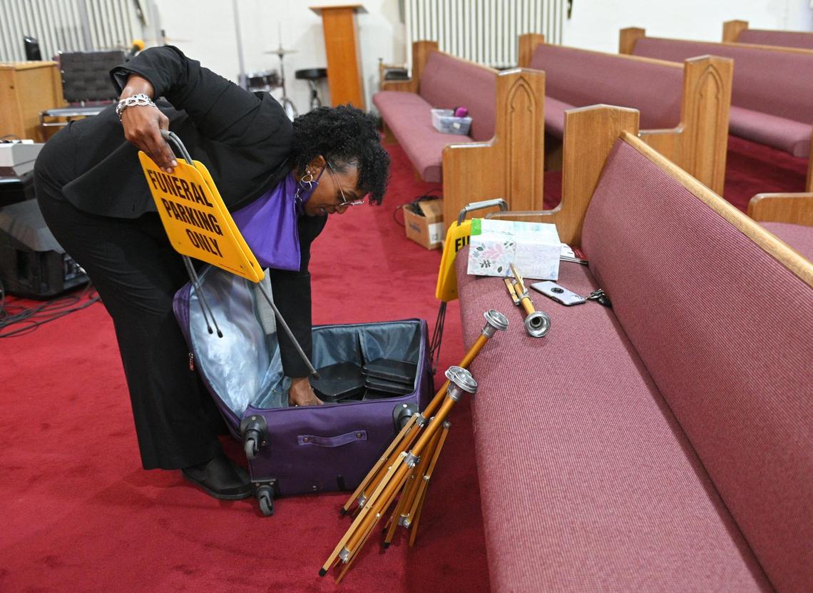 Mortician Gwendelrae of Northern Star Mortuary prepares Paseo Baptist Church in Kansas City for a recent funeral.