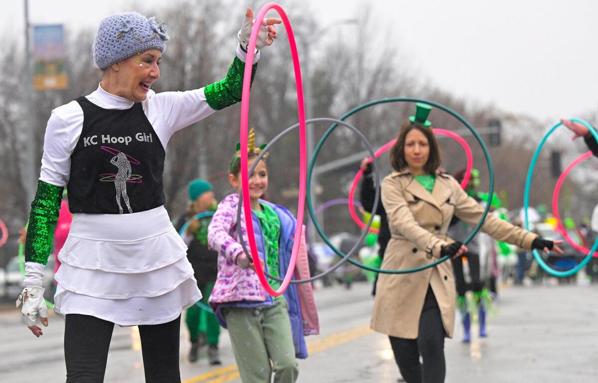 Members of KC Hoop Girl including Sirenna Beyer hooped in up during the 2023 Brookside St. Patrick’s Day Warm-Up Parade on Saturday March 11, 2023 in Kansas City.