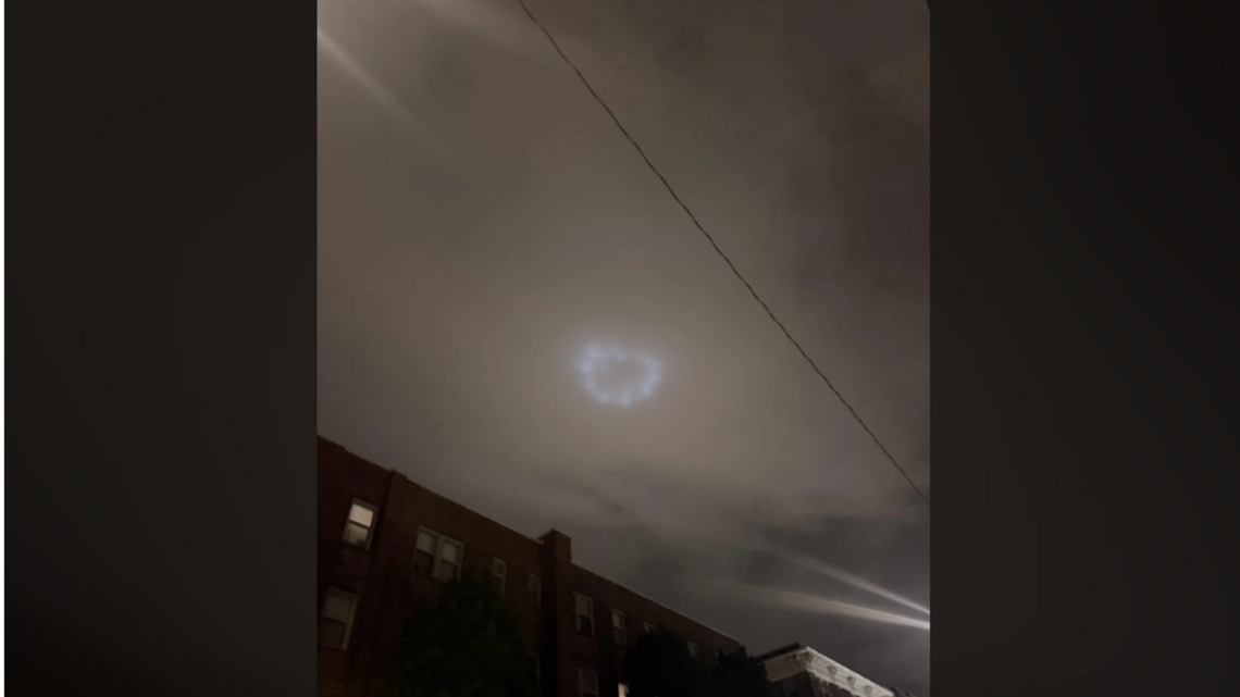 What caused eerie lights to appear over downtown Kansas City Sunday night?