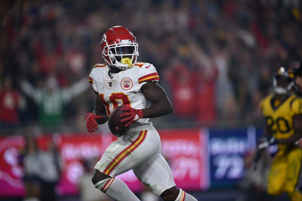 Kansas City Chiefs wide receiver Tyreek Hill runs for a touchdown after making a catch against the Los Angeles Rams in the fourth quarter. It was Chiefs quarterback Patrick Mahomes’ 36th touchdown of the 2018 regular season.